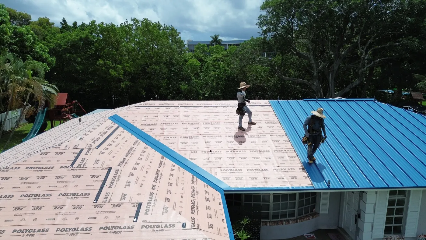 ReNova crew setting metal panels ridge to eave